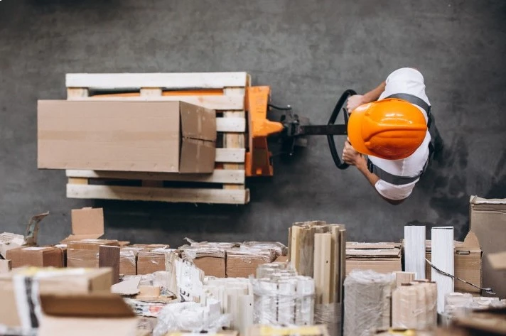 SMS fulfillment warehouse insideyoung-man-working-warehouse-with-boxes (1)