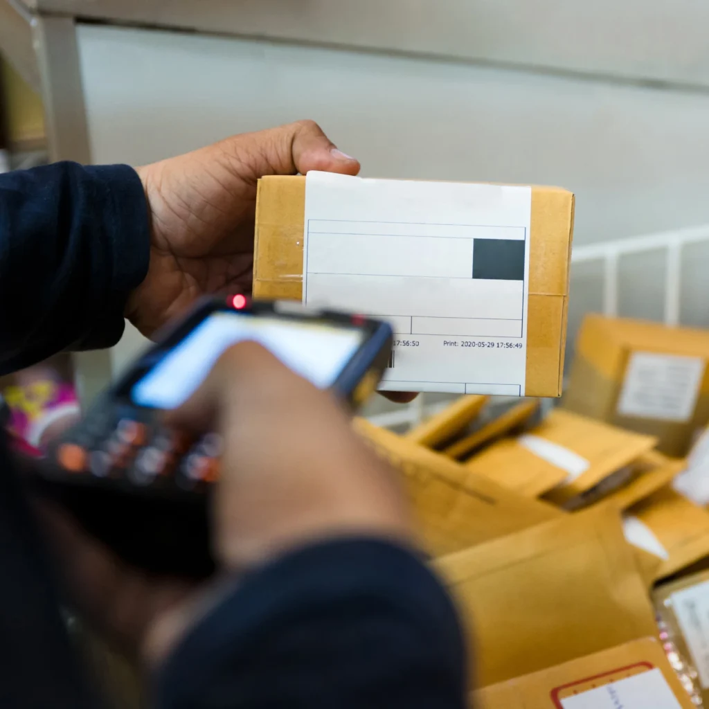 SMS fulfillment pick and pack process delivery man scanning package